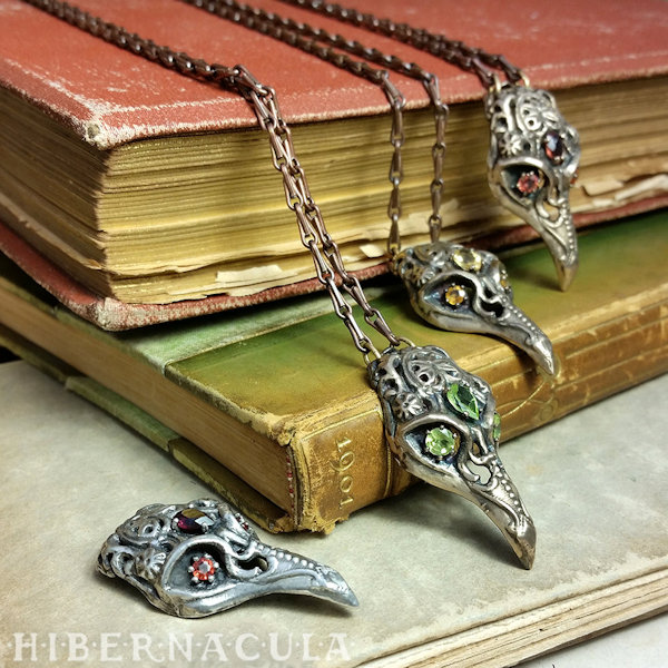 Bronze and Silver Bird Skull Necklaces