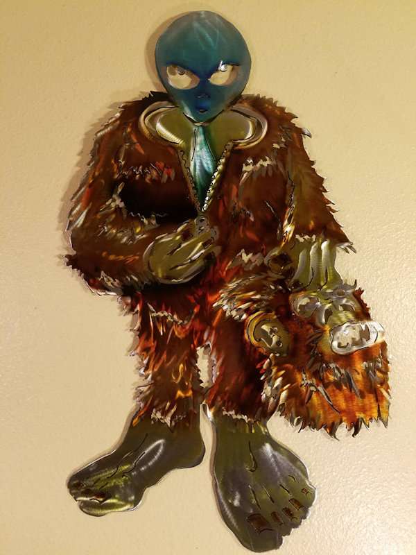 Alien In Bigfoot Costume Metal Wall Art